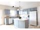 Bright kitchen with stainless steel appliances, kitchen island and plenty of cabinet space at 10946 Garden Oaks Ln, Charlotte, NC 28273