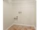 Tiled laundry room ready for appliances at 10946 Garden Oaks Ln, Charlotte, NC 28273