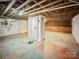 Unfinished basement with shelving and storage space at 115 E Texas Ave, Bessemer City, NC 28016