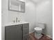 Updated bathroom with gray vanity and gold fixtures at 115 E Texas Ave, Bessemer City, NC 28016