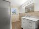 Clean bathroom with marble vanity and tiled walls at 115 E Texas Ave, Bessemer City, NC 28016