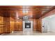 Dining room with wood paneling, chandelier, and hardwood floors at 115 E Texas Ave, Bessemer City, NC 28016