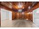 Dining room with wood paneling, chandelier and hardwood floors at 115 E Texas Ave, Bessemer City, NC 28016