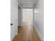 Light-filled hallway with hardwood floors and access to rooms at 115 E Texas Ave, Bessemer City, NC 28016