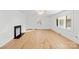 Spacious living room with hardwood floors and a fireplace at 115 E Texas Ave, Bessemer City, NC 28016