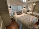 Cozy bedroom with a queen-size bed and decorative pillows at 130 Badin Lake Cir, New London, NC 28127