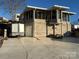 Brick house exterior with screened porch and attached garage at 130 Badin Lake Cir, New London, NC 28127