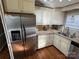 Modern kitchen with stainless steel appliances and granite countertops at 130 Badin Lake Cir, New London, NC 28127