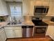 Kitchen features stainless steel appliances and granite countertops at 130 Badin Lake Cir, New London, NC 28127