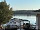 Serene lake view with private dock and boathouse at 130 Badin Lake Cir, New London, NC 28127