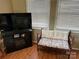 Living room with a small settee and a fireplace at 130 Badin Lake Cir, New London, NC 28127