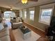 Living room with a lake view and access to a deck at 130 Badin Lake Cir, New London, NC 28127