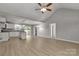 Open-concept living room featuring wood floors, vaulted ceiling, and a kitchen with a central island at 1345 Mack Dr, McConnells, SC 29726