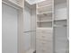 Large walk-in closet with built-in shelving and drawers offers ample storage space at 141 N Arcadian Way, Mooresville, NC 28117