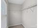 This walk-in closet features one row of wire shelving at 141 N Arcadian Way, Mooresville, NC 28117