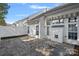 Paver patio features white siding, awning, and windows for outdoor enjoyment and curb appeal at 141 N Arcadian Way, Mooresville, NC 28117