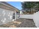 Paver patio features white siding, awning, and windows for outdoor enjoyment and curb appeal at 141 N Arcadian Way, Mooresville, NC 28117