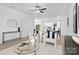 Open-concept living room with modern furnishings flowing into the kitchen and dining area at 14309 King Eider Dr, Charlotte, NC 28273