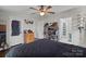 Primary bedroom with ceiling fan and ample closet space at 15918 Big Bear Rd, Albemarle, NC 28001