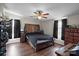 Spacious bedroom with ceiling fan and wood flooring at 15918 Big Bear Rd, Albemarle, NC 28001