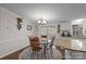 Kitchen dining area with a round wooden table and four chairs at 15918 Big Bear Rd, Albemarle, NC 28001