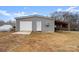 Detached gray garage with additional covered parking area at 15918 Big Bear Rd, Albemarle, NC 28001