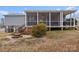 Gray house exterior with large screened porch and stairs at 15918 Big Bear Rd, Albemarle, NC 28001