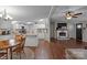 Kitchen features white cabinets, island, and dining area at 15918 Big Bear Rd, Albemarle, NC 28001