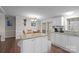 Island kitchen with granite countertops and white cabinets at 15918 Big Bear Rd, Albemarle, NC 28001