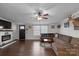 Spacious living room with L-shaped sofa and fireplace at 15918 Big Bear Rd, Albemarle, NC 28001