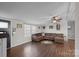 Living room with L-shaped sofa and fireplace at 15918 Big Bear Rd, Albemarle, NC 28001