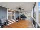 This screened porch features a ceiling fan, outdoor cooking area and access to the yard at 15918 Big Bear Rd, Albemarle, NC 28001