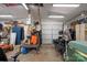 Workshop with well-organized storage, a motorcycle, and a riding lawnmower at 15918 Big Bear Rd, Albemarle, NC 28001