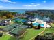 An aerial view shows the neighborhood amenities, including swimming pools and tennis courts at 162 Wild Harbor Rd, Mooresville, NC 28117