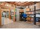 Unfinished basement featuring exposed ceiling beams, shelving, and storage for organizing household items at 162 Wild Harbor Rd, Mooresville, NC 28117