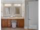 Bathroom with double vanity, granite countertops, and framed mirrors at 162 Wild Harbor Rd, Mooresville, NC 28117