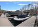 Waterfront boat dock with boats; the perfect place to moor your vessel and enjoy lake activities at 162 Wild Harbor Rd, Mooresville, NC 28117