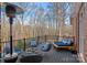 Relaxing outdoor deck with comfortable seating and a serene wooded view at 162 Wild Harbor Rd, Mooresville, NC 28117