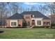 Charming brick and siding home with a landscaped yard and mature trees at 162 Wild Harbor Rd, Mooresville, NC 28117