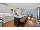 Bright eat-in kitchen boasts a large kitchen island with seating and modern appliances at 162 Wild Harbor Rd, Mooresville, NC 28117