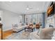 Bright living room featuring coffered ceilings, fireplace and large windows at 162 Wild Harbor Rd, Mooresville, NC 28117