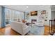 Cozy living room with a fireplace, built-in shelving, and a large window at 162 Wild Harbor Rd, Mooresville, NC 28117