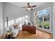 Bright home office featuring wood floors, a ceiling fan, and a large window at 162 Wild Harbor Rd, Mooresville, NC 28117