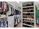 Organized walk-in closet with custom shelving for clothes, shoes and storage at 162 Wild Harbor Rd, Mooresville, NC 28117