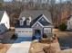 Two-story home with gray exterior and stone accents at 16400 Cozy Cove Rd, Charlotte, NC 28278