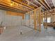 Unfinished basement with plumbing and framed walls at 16400 Cozy Cove Rd, Charlotte, NC 28278