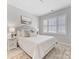 Bright bedroom with window shutters and neutral decor at 16400 Cozy Cove Rd, Charlotte, NC 28278