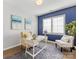 Bright home office with a white desk and blue accent wall at 16400 Cozy Cove Rd, Charlotte, NC 28278