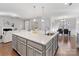 Modern kitchen with large island and stainless steel appliances at 16400 Cozy Cove Rd, Charlotte, NC 28278