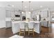 Spacious kitchen with a large island and white quartz countertops at 16400 Cozy Cove Rd, Charlotte, NC 28278